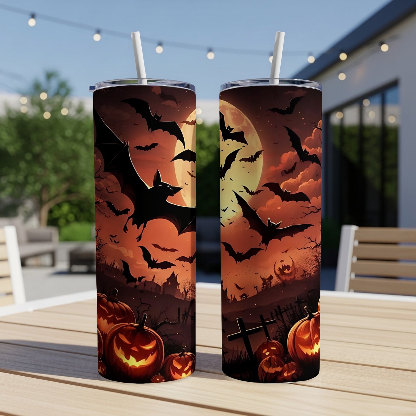 Halloween tumblers with bats, jack-o'-lanterns, and a spooky moonlit scene.