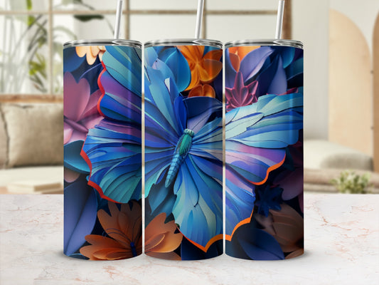 Three tumblers with vibrant blue butterfly and floral designs.