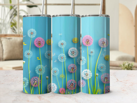 Three blue tumblers with dandelion designs and straws.