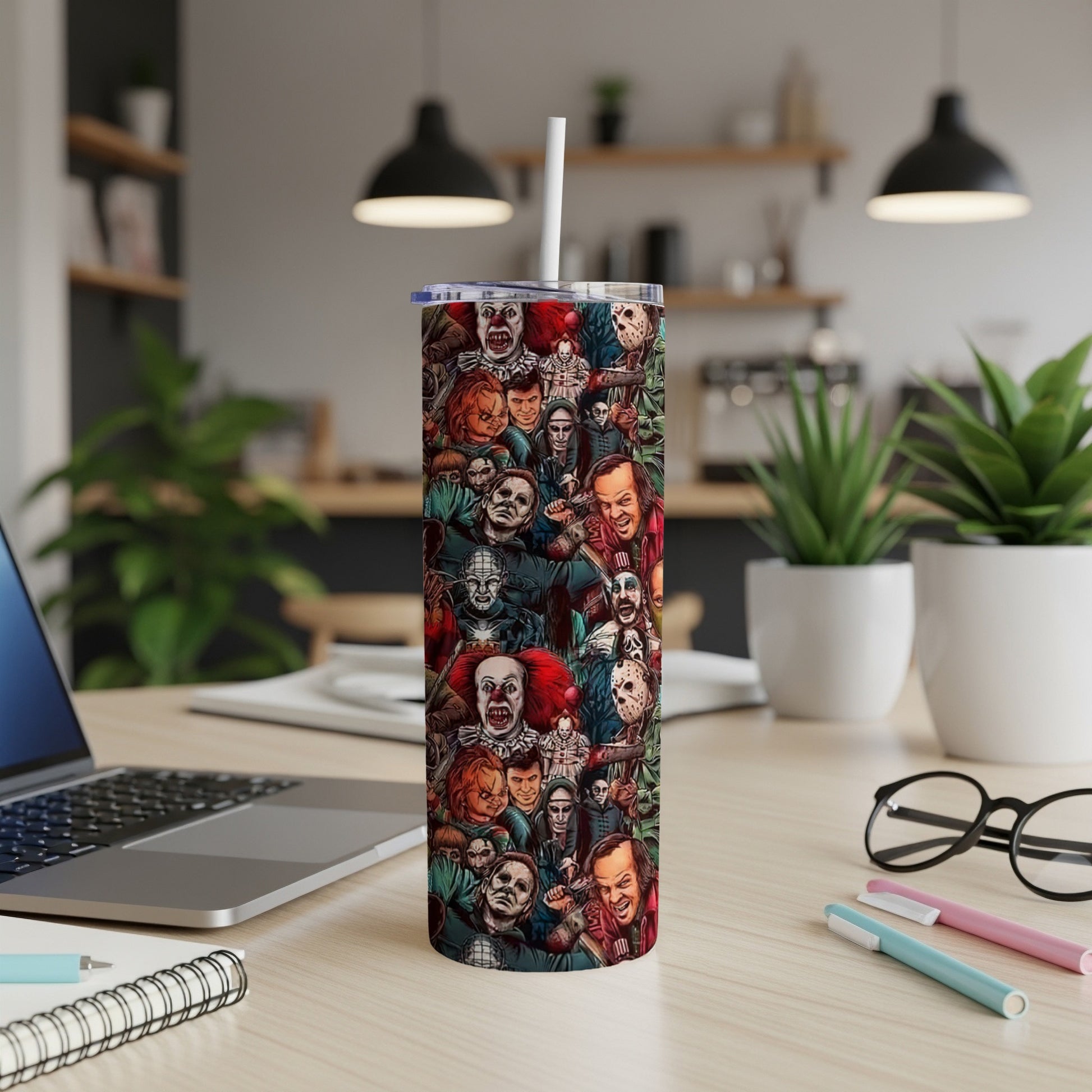 Tumbler featuring a collage of classic horror movie villains, including Pennywise and Michael Myers.