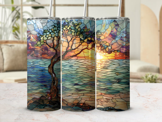 Three tumblers featuring stained glass tree at sunset over water.