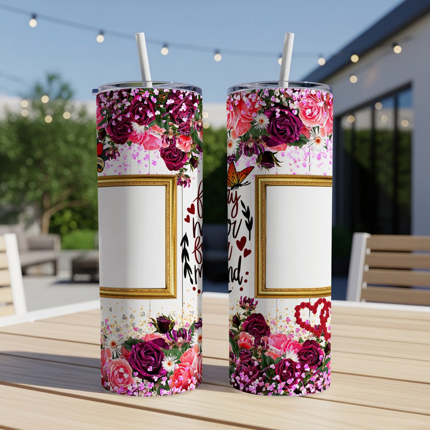 Two floral tumblers with golden frames and text "Forever my friend" displayed outdoors.