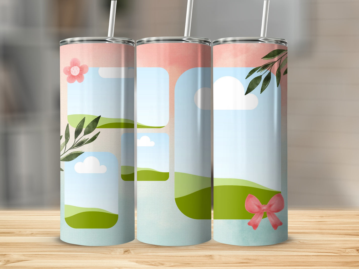 Three tumblers with watercolor landscape, clouds, flowers, leaves, and bows.