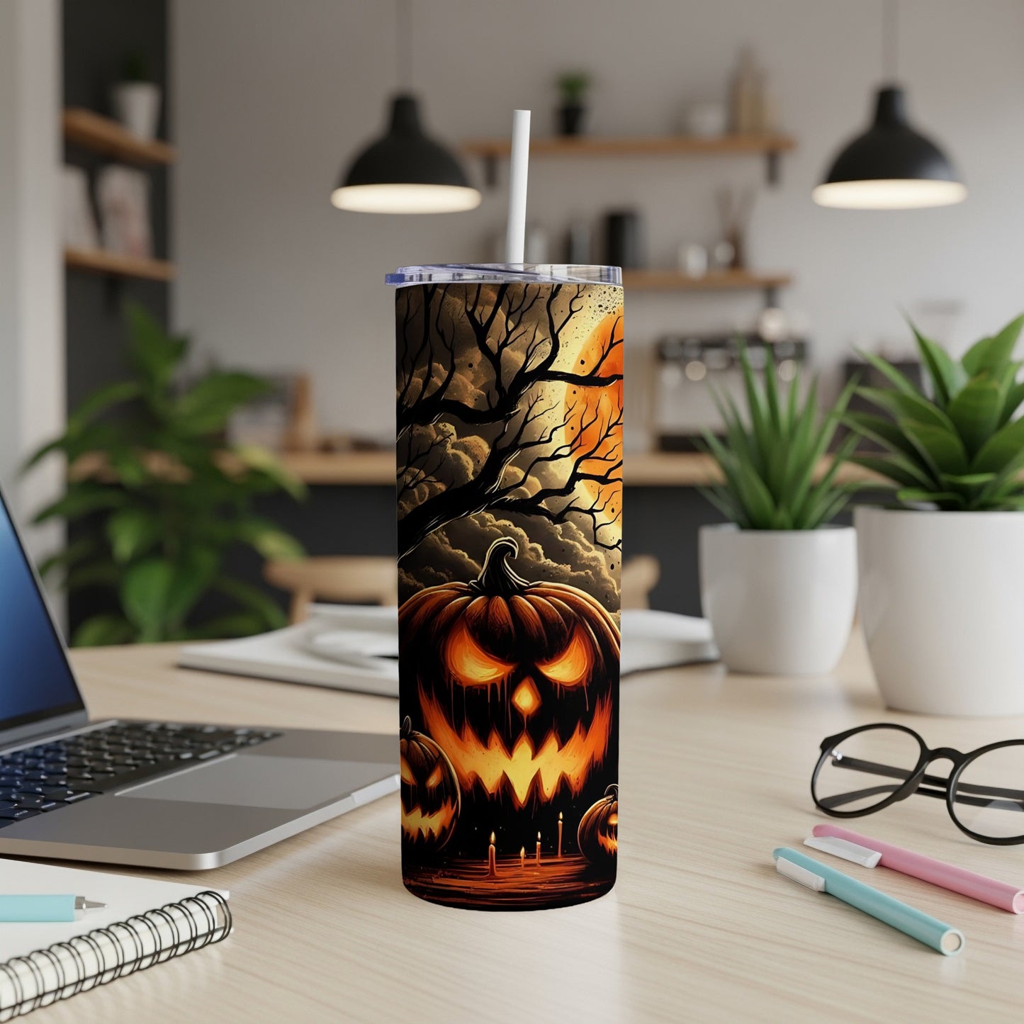 Tall tumbler with a Halloween jack-o'-lantern and spooky tree design.