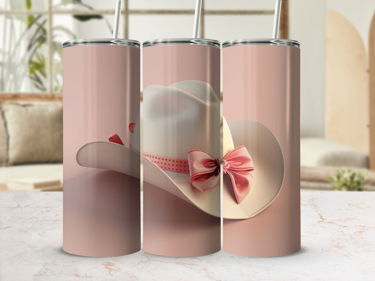 Three pink tumblers featuring a white cowboy hat with a pink ribbon.
