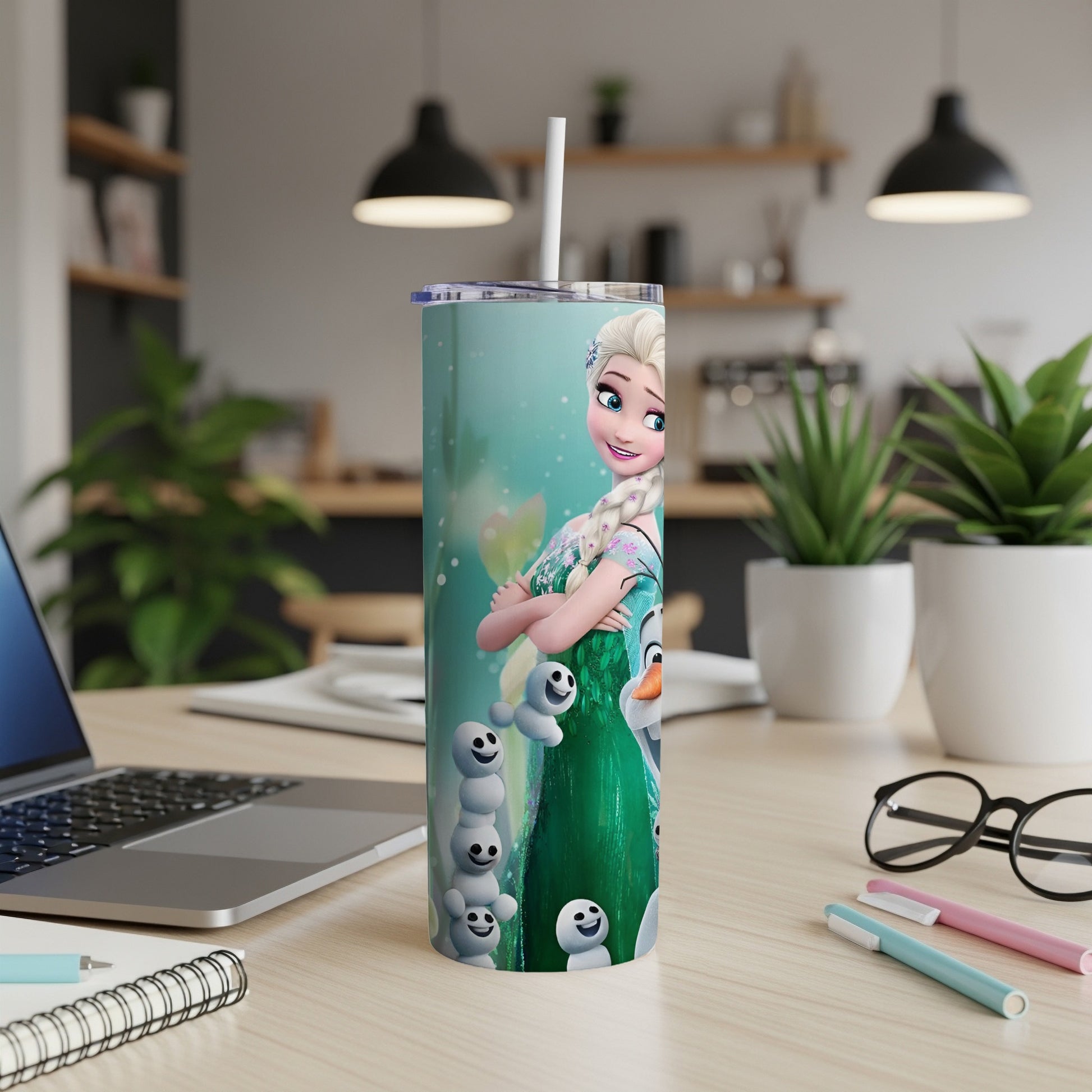 Frozen Elsa and Olaf on a teal tumbler with a white straw.