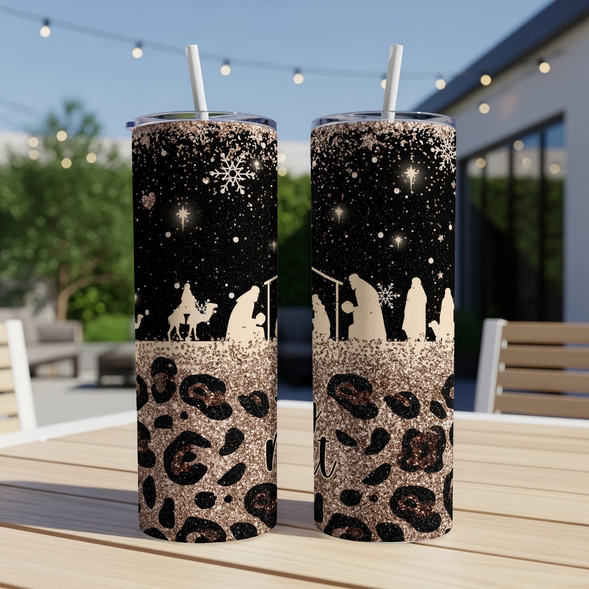 Two tall tumblers with nativity scene and leopard print design.