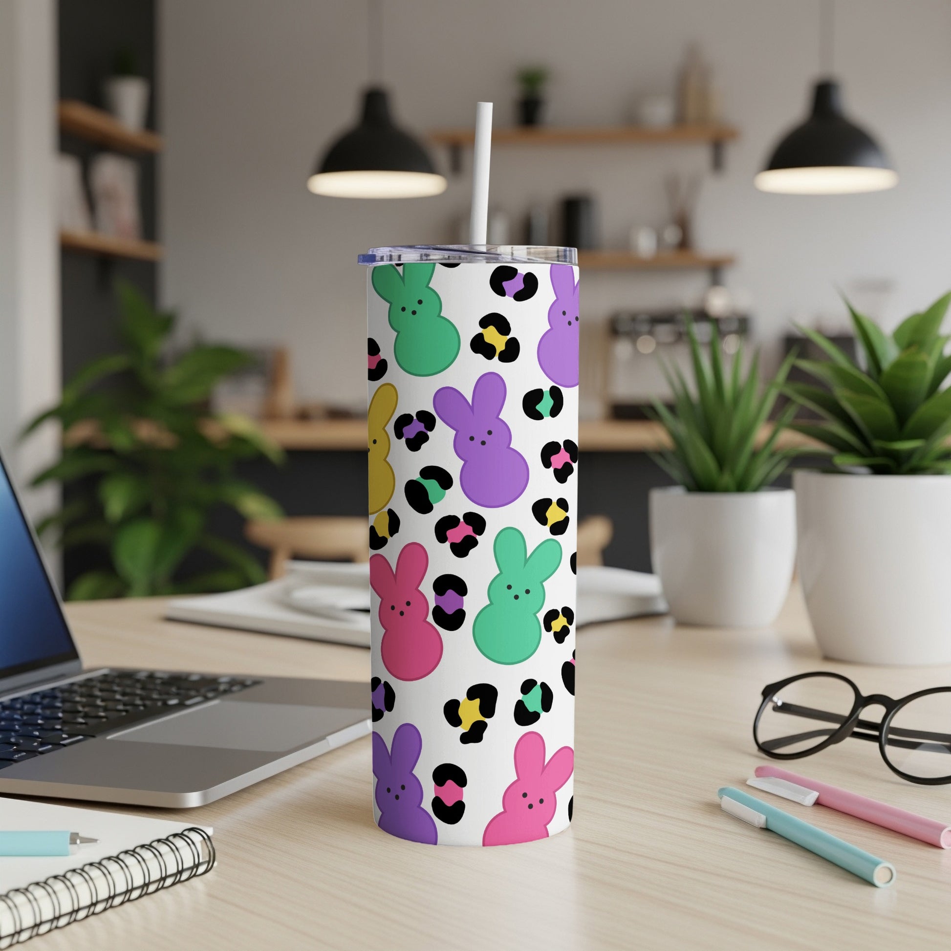 White tumbler with colorful Peeps bunnies and leopard print pattern.