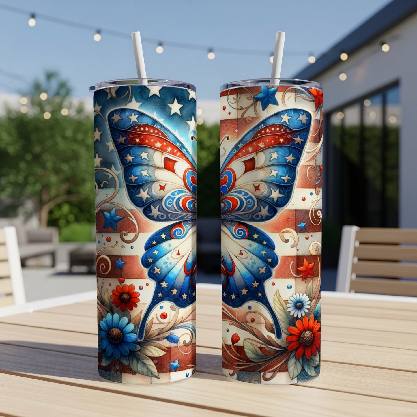 Two patriotic butterfly tumblers with floral accents on a table.