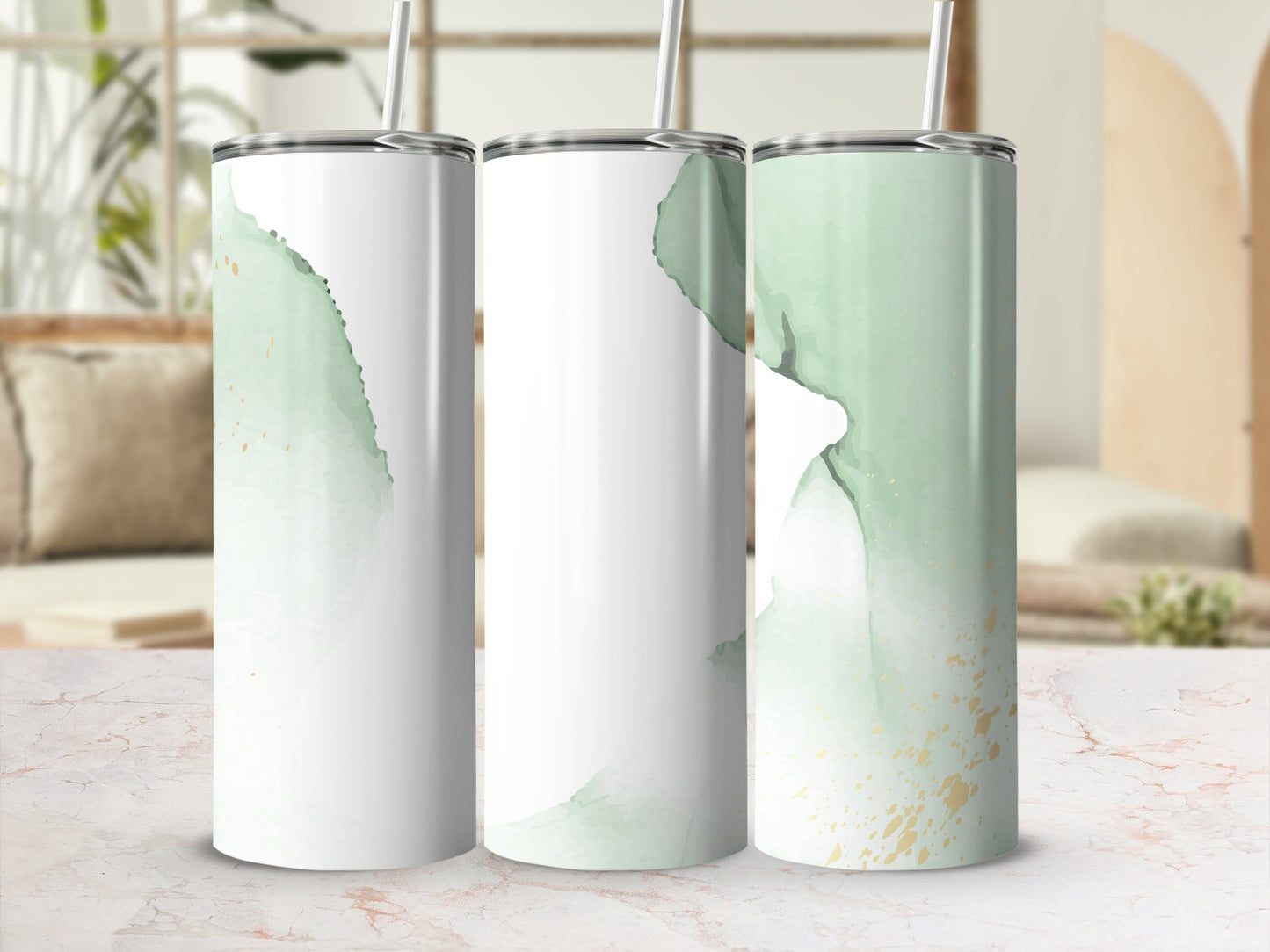Three white tumblers with green watercolor and gold fleck design.