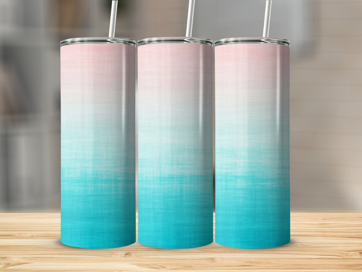 Three tall tumblers with a pink to teal gradient design.