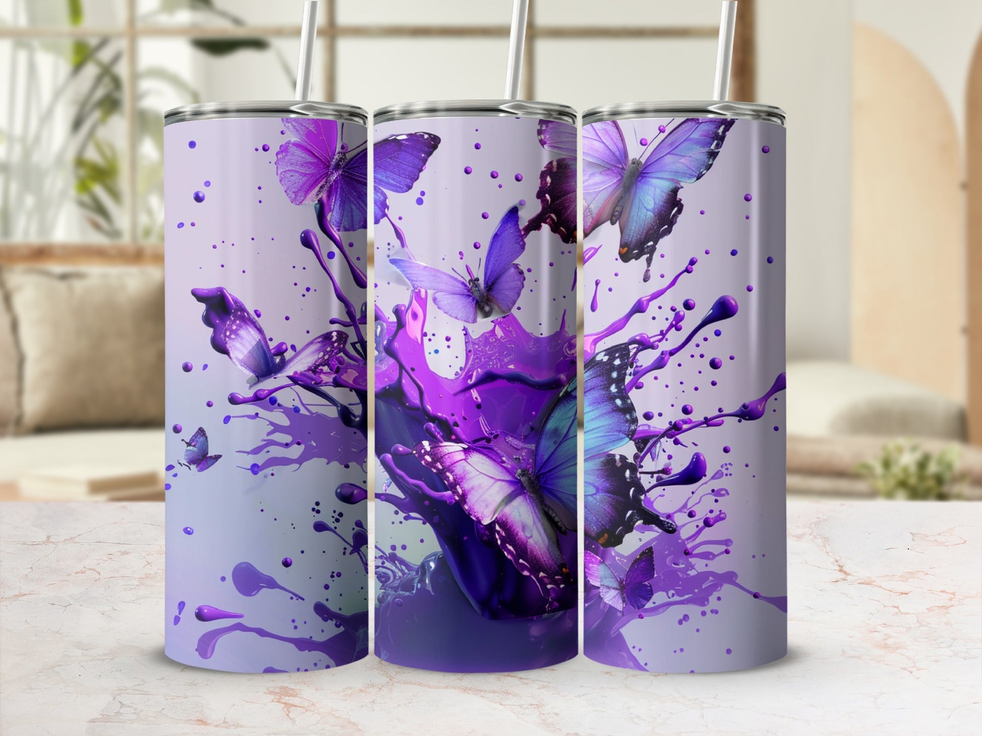 Three tumblers with purple butterfly and paint splatter design.