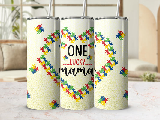 Tumbler with a heart made of puzzle pieces and "One Lucky Mama" text.