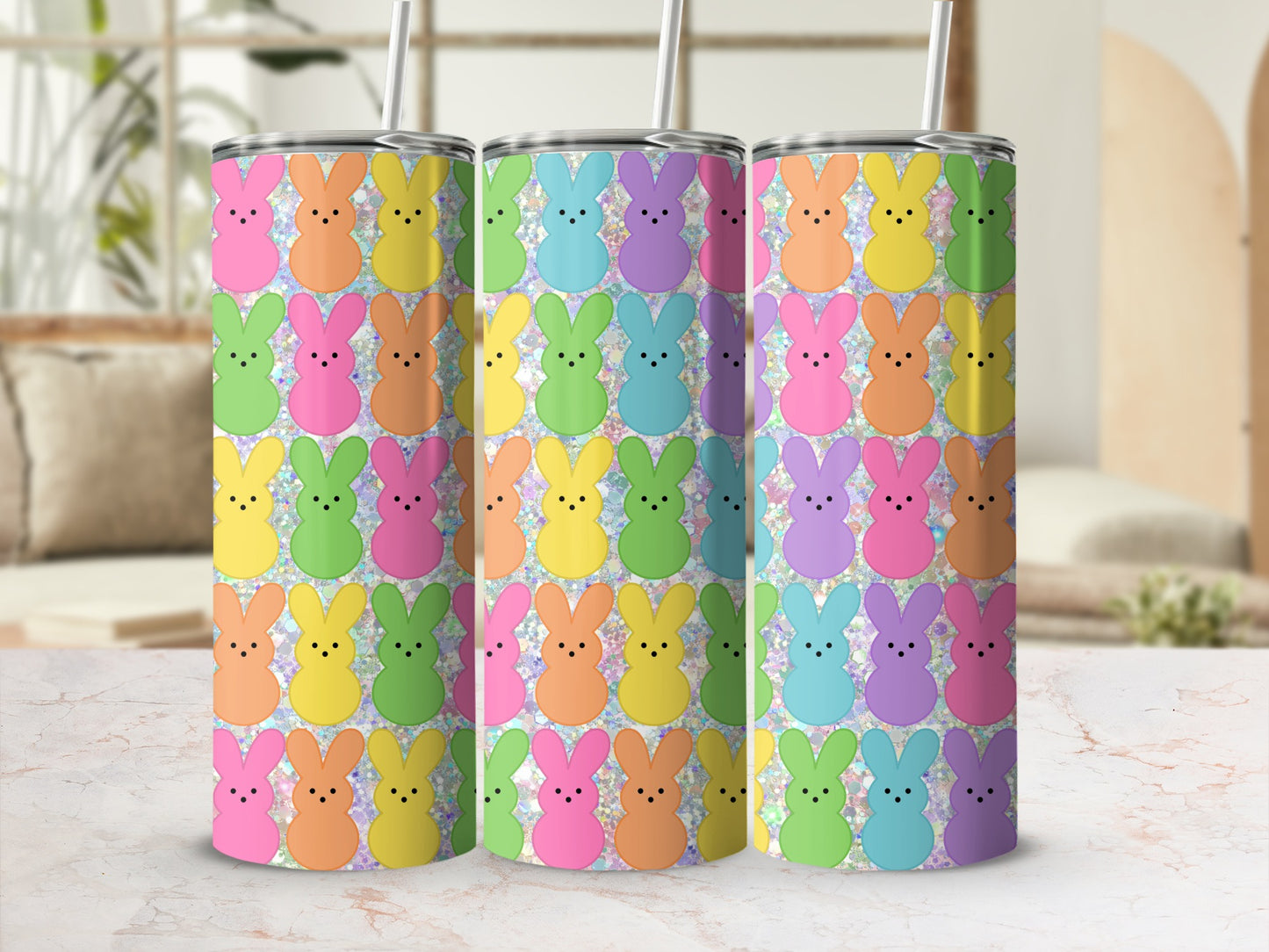 Three tumblers with a repeating pattern of colorful pastel Easter bunnies.