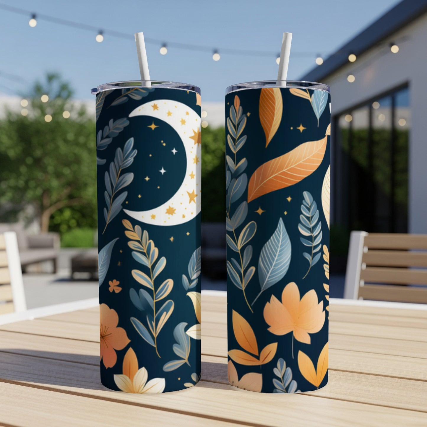 Two tall, dark blue tumblers with celestial moon and leaf pattern.