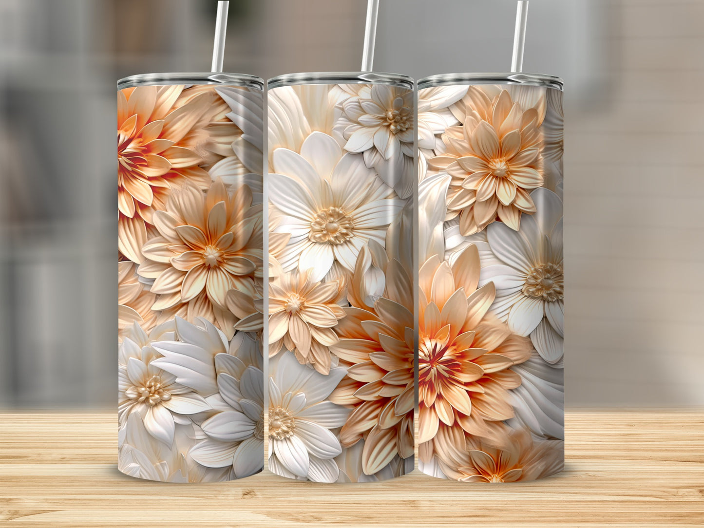 Three tumblers with a detailed floral relief pattern in cream and orange.