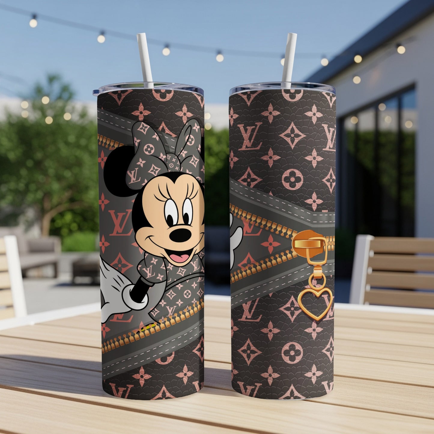 Minnie Mouse on a dark patterned tumbler with zipper and heart charm.