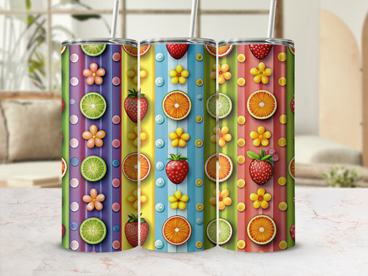 Three colorful tumblers with fruit and flower patterns, on a table.