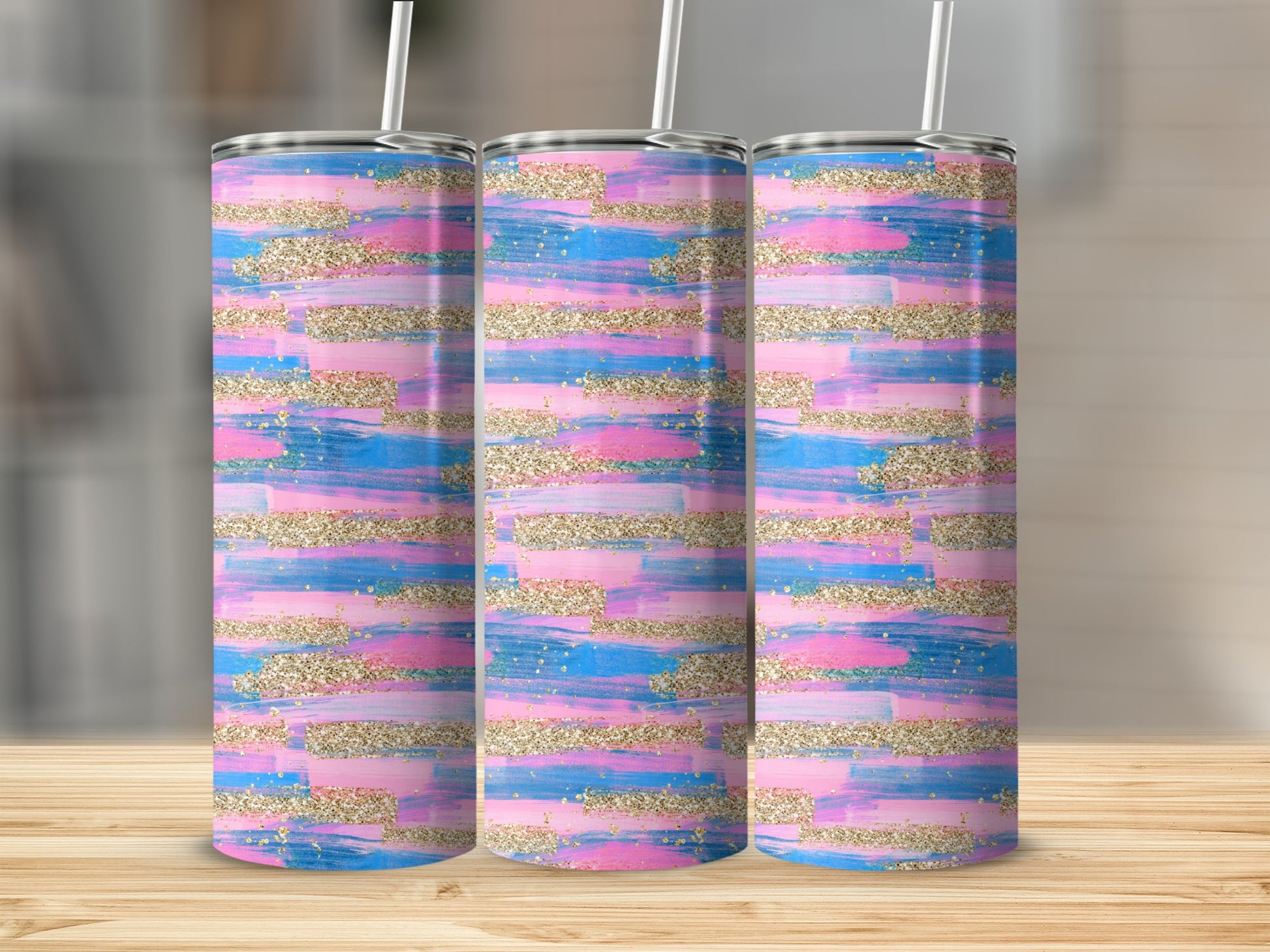 Three tall, skinny tumblers with pink, blue, and gold glitter brushstroke design.