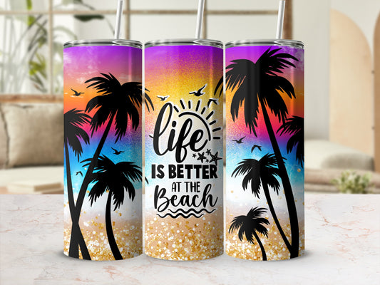 Purple and gold gradient tumbler with palm trees and "Life is Better at the Beach" text.