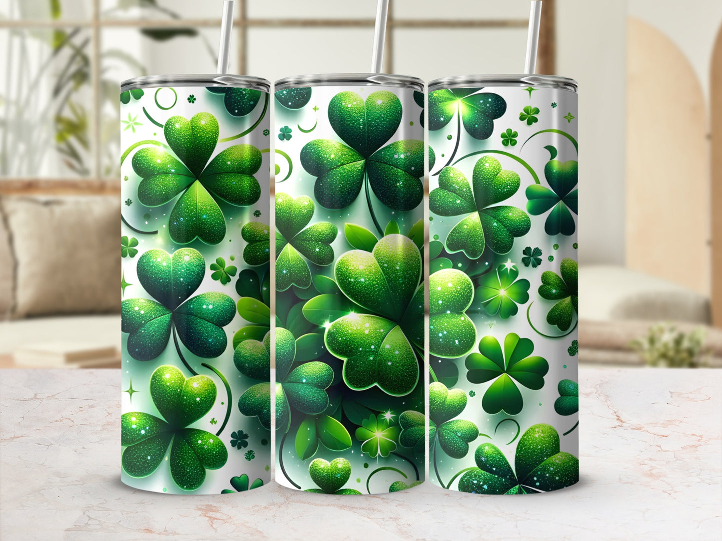 Three green shamrock patterned tumblers with straws.