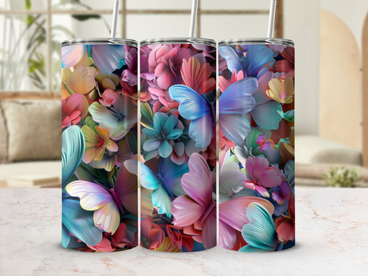 Three tall tumblers with a colorful floral and butterfly pattern.