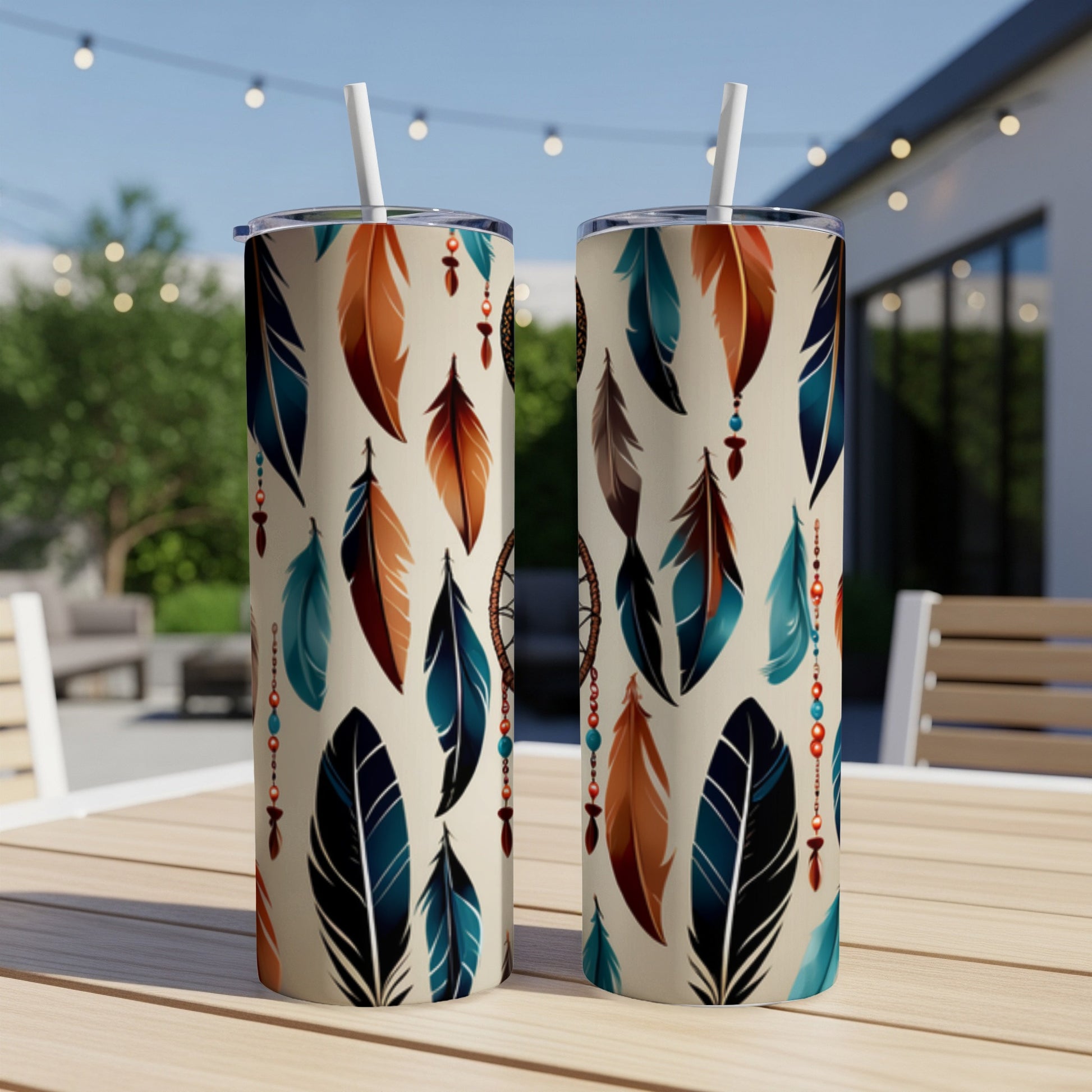 Two tan tumblers with feather and dreamcatcher pattern.