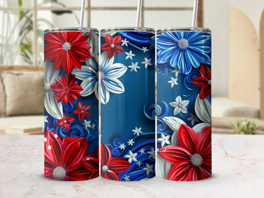 Three tumblers with patriotic floral designs on a speckled surface.