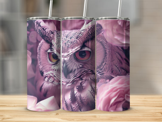 Close-up of an owl's face and pink flowers on a tumbler.