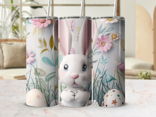 Easter bunny with eggs and floral background on a tumbler.