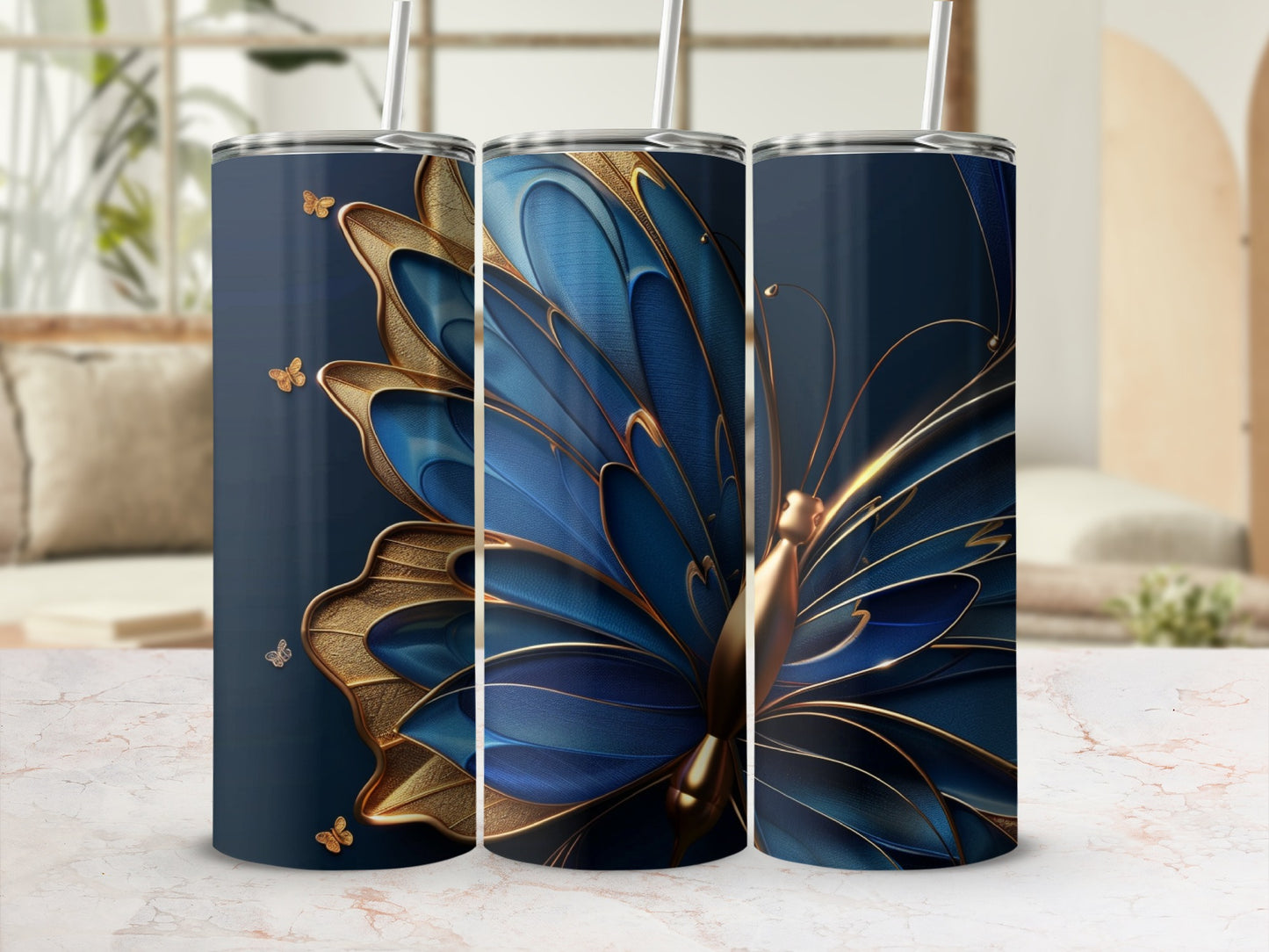 Three tumblers featuring a blue and gold butterfly design on a dark blue background.