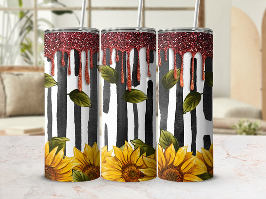 Three tumblers with sunflowers and black stripes, topped with red glitter.