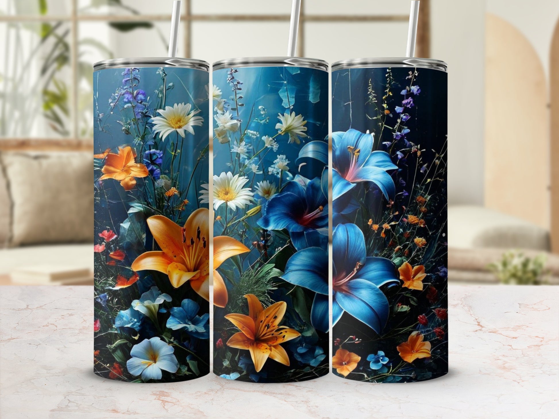 Three tumblers featuring vibrant blue and orange lilies and white wildflowers.
