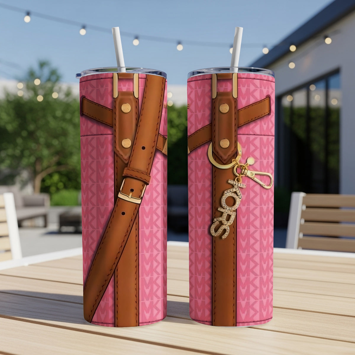Two pink tumblers with brown straps and gold "MK" logo keychain.