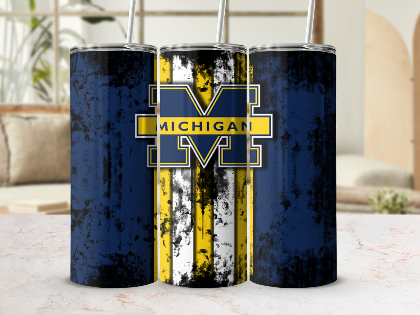 Michigan Wolverines distressed navy and yellow striped tumbler with logo.