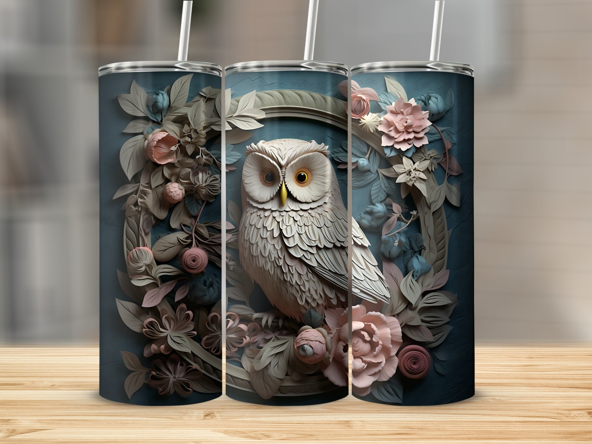 Owl and floral design on three tumblers.