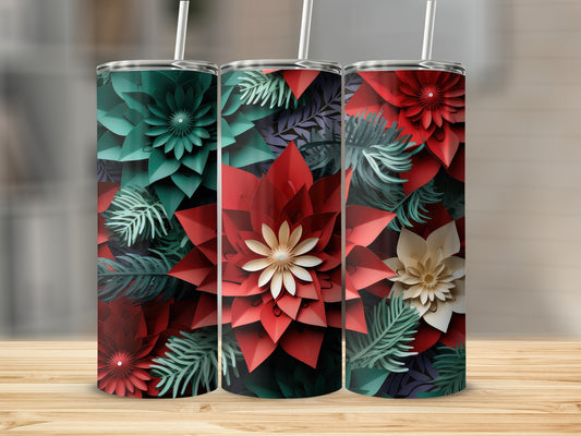 Three tumblers with red and green floral designs stand on a wooden surface.