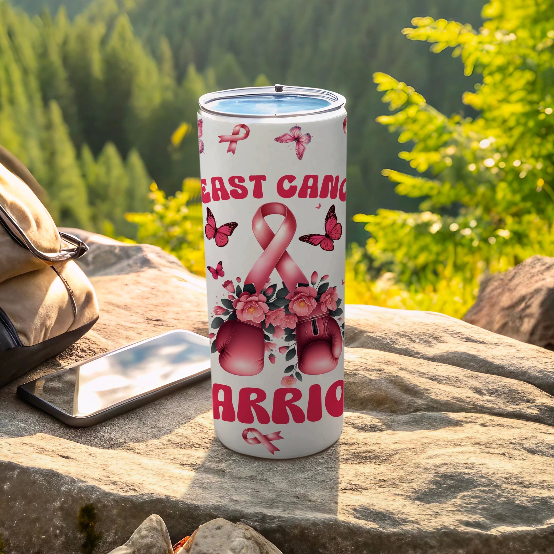 Pink breast cancer warrior tumbler with ribbons and butterflies.