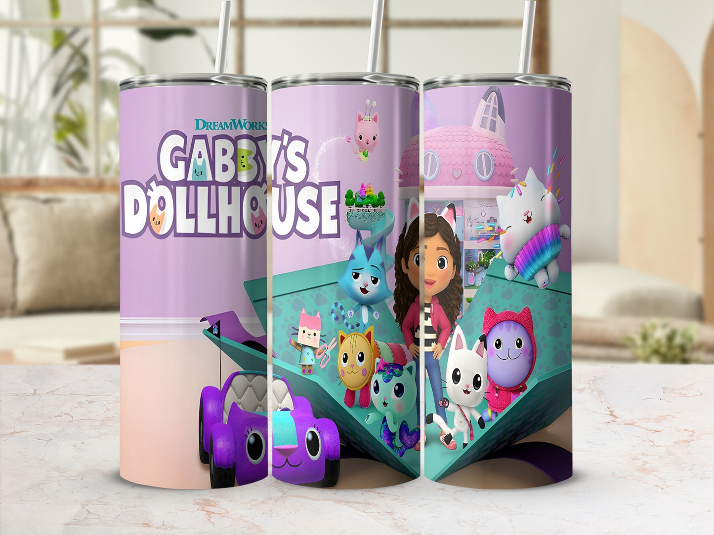 Gabby's Dollhouse tumbler with characters and a purple toy car.