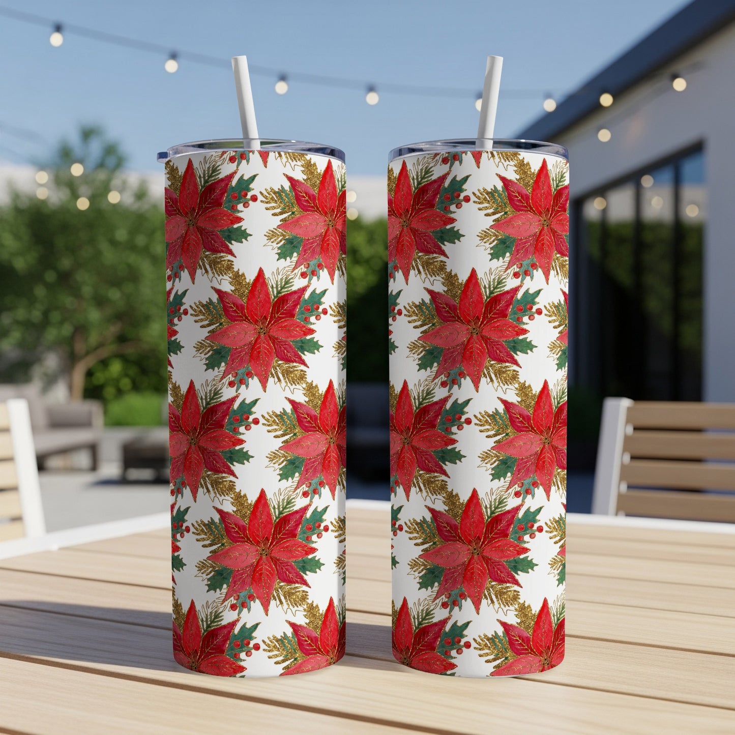 Two tumblers with a red poinsettia and gold glitter holiday pattern.