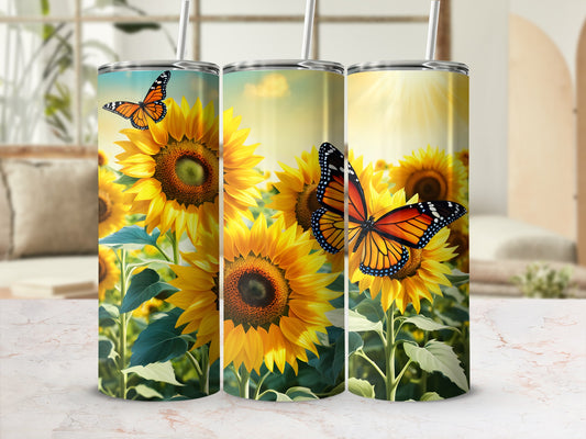 Three tumblers with sunflowers and monarch butterflies against a bright background.