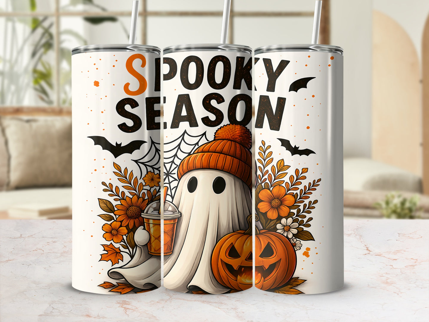 "Spooky Season" text on tumblers with ghosts, pumpkins, bats, and flowers.