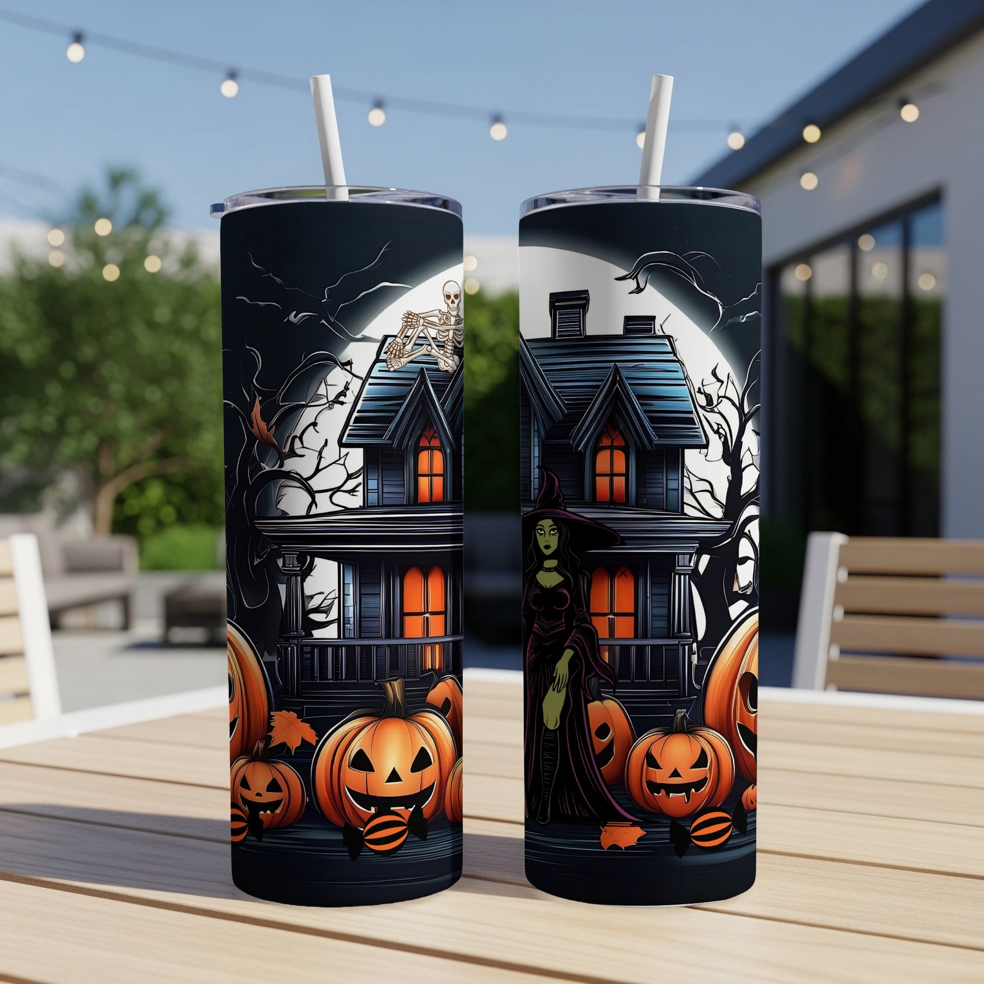 Halloween themed tumblers with witch, haunted house, and pumpkins.