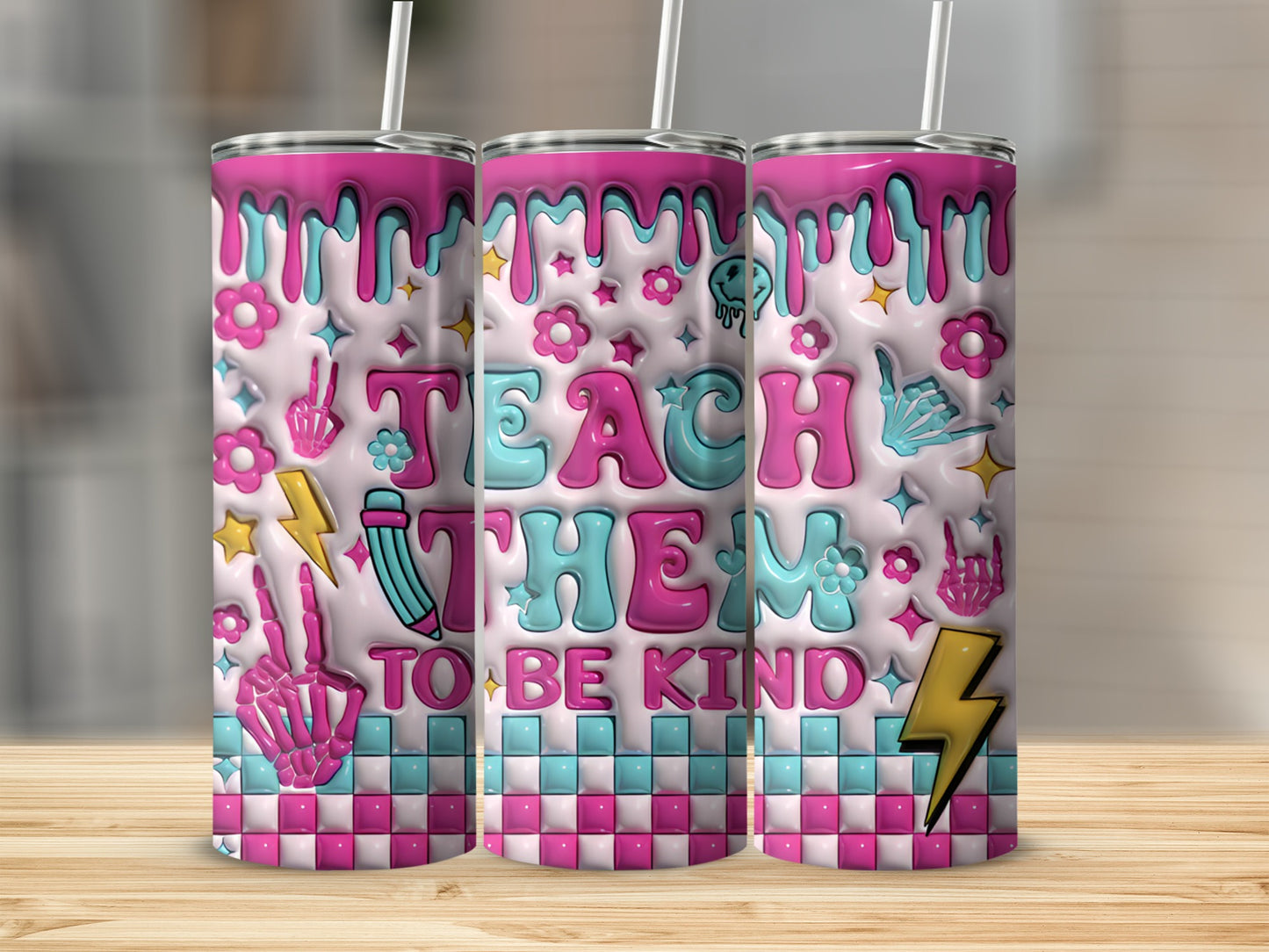Pink and blue tumbler with "Teach Them to Be Kind" and quirky classroom icons.