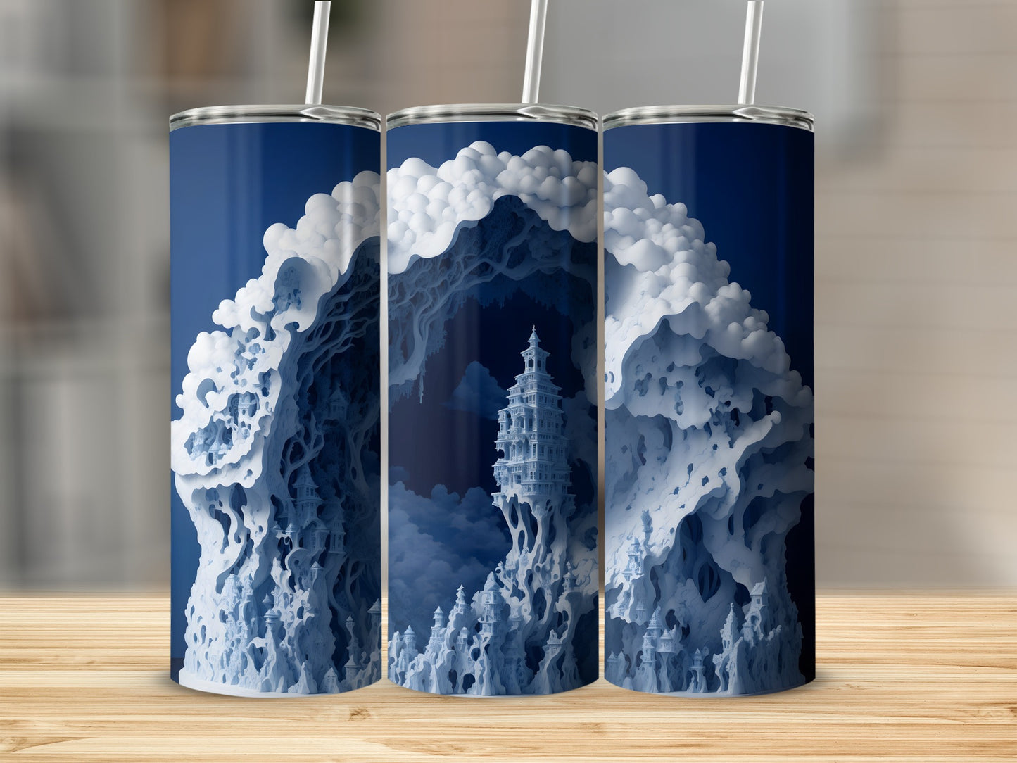Blue and white stylized castle and mountain landscape on three tumblers.