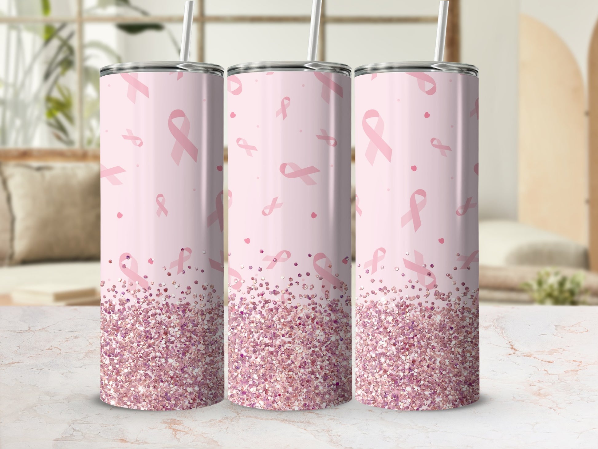 Pink glitter tumbler with breast cancer awareness ribbons and straw.