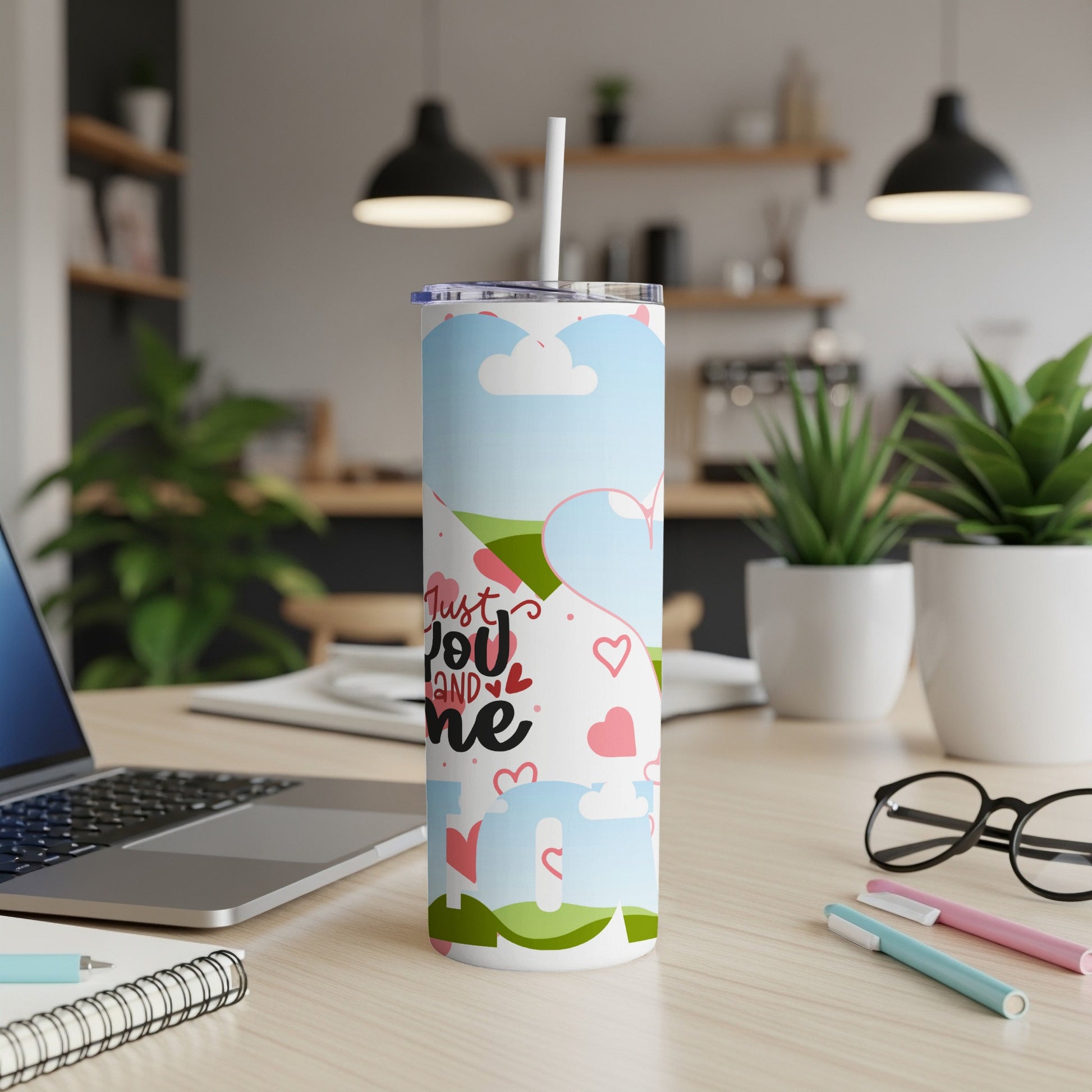 Tall tumbler with "Just You and Me" text and heart graphics.