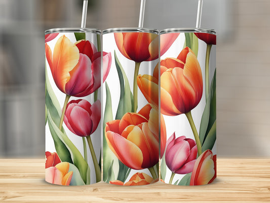 Tulips in shades of red and orange on a white background, displayed on tumblers.