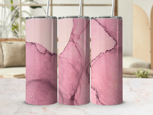 Three tumblers with pink marble and gold accents, with straws.