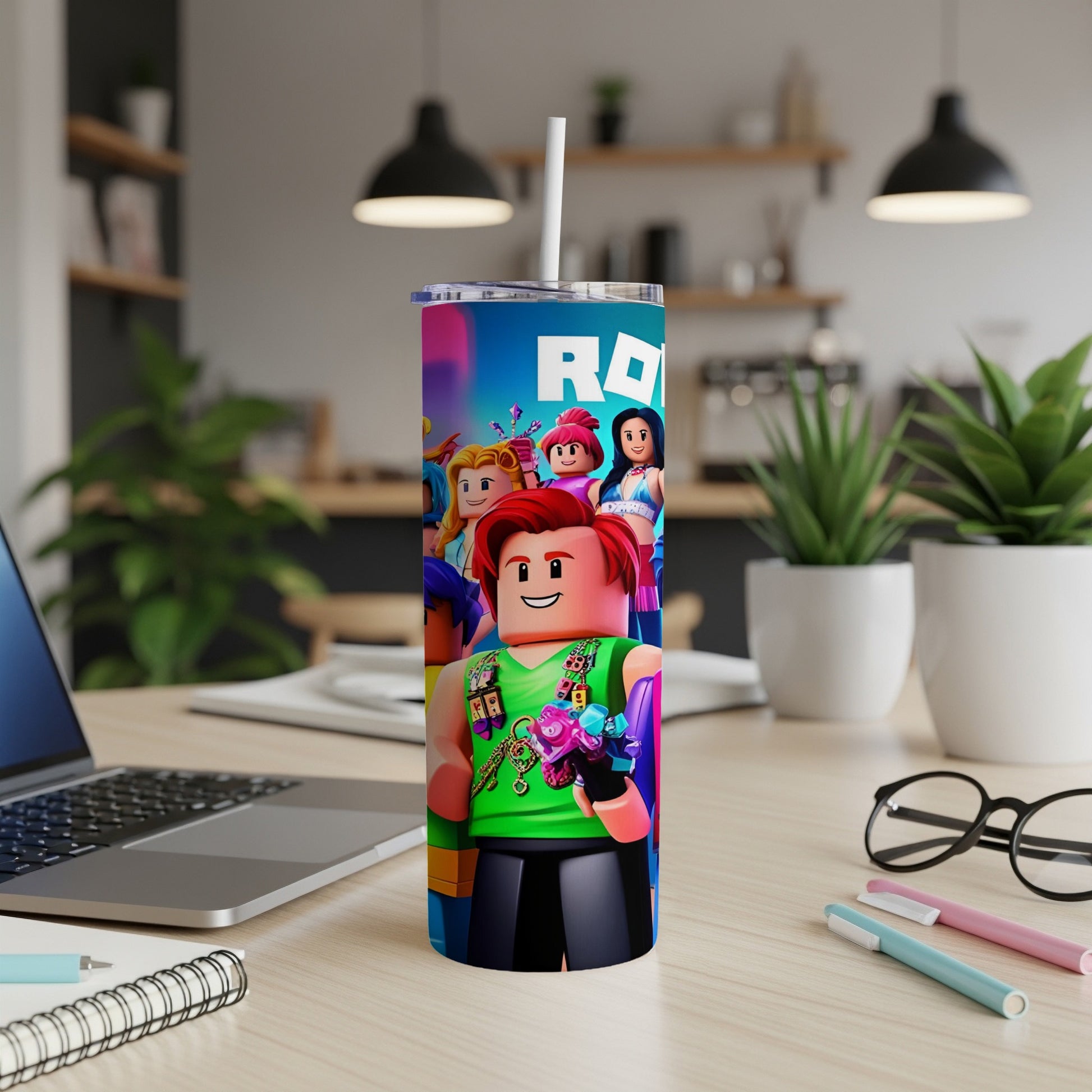 Roblox character tumbler with straws and flowers, on a desk.